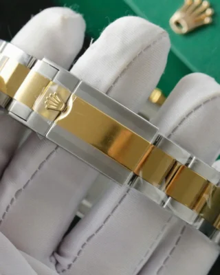 Replica Rolex Daytona Black Dial Gold Bezel Two Tone Oyster Bracelet