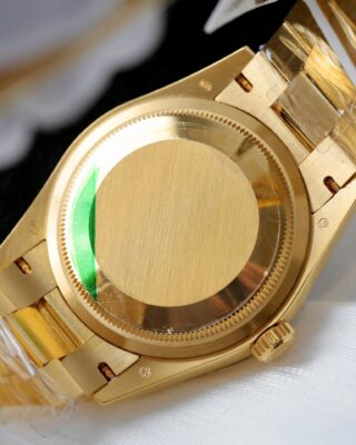 Replica Rolex Day-Date Fluted Bezel Green Dial Presidential Bracelet on white glove