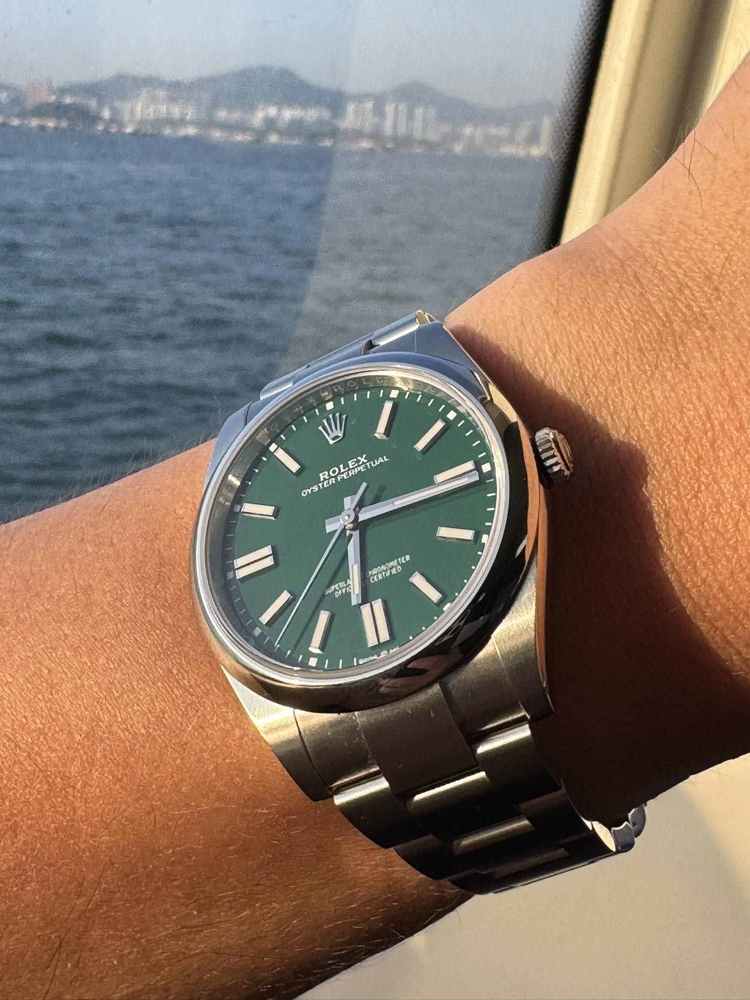 Click to view full screen Green Dial Replica Rolex Oyster Perpetual on wrist