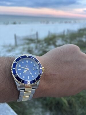Click to view full screen Replica Rolex Bluesy review image with sea on the background