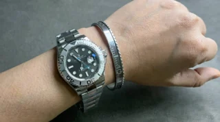 Close-up of Yacht-Master Rhodium Dial 126622 watch with elegant silver dial on a man's wrist, premium titanium steel bracelet