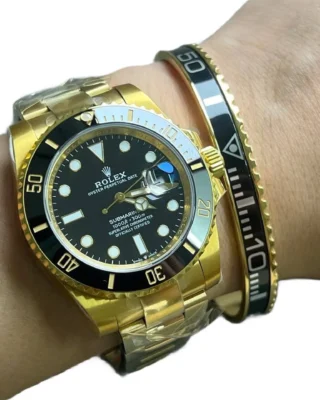 Black Gold Submariner Gold Tone Titanium Steel Bracelet on wrist with two-tone Rolex Submariner watch