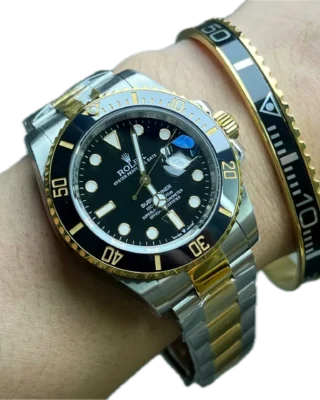 Black Gold Submariner Gold Tone Titanium Steel Bracelet worn on wrist with two-tone Rolex Submariner watch