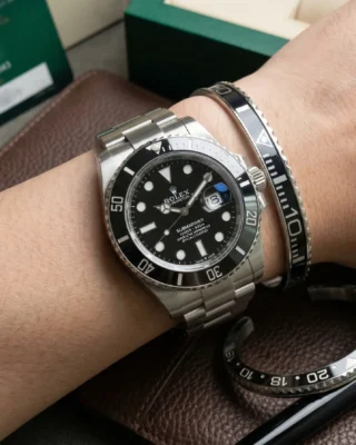 Close-up of a wrist wearing a sleek Black Submariner Titanium Steel Bracelet perfectly paired with a Rolex Submariner watch.