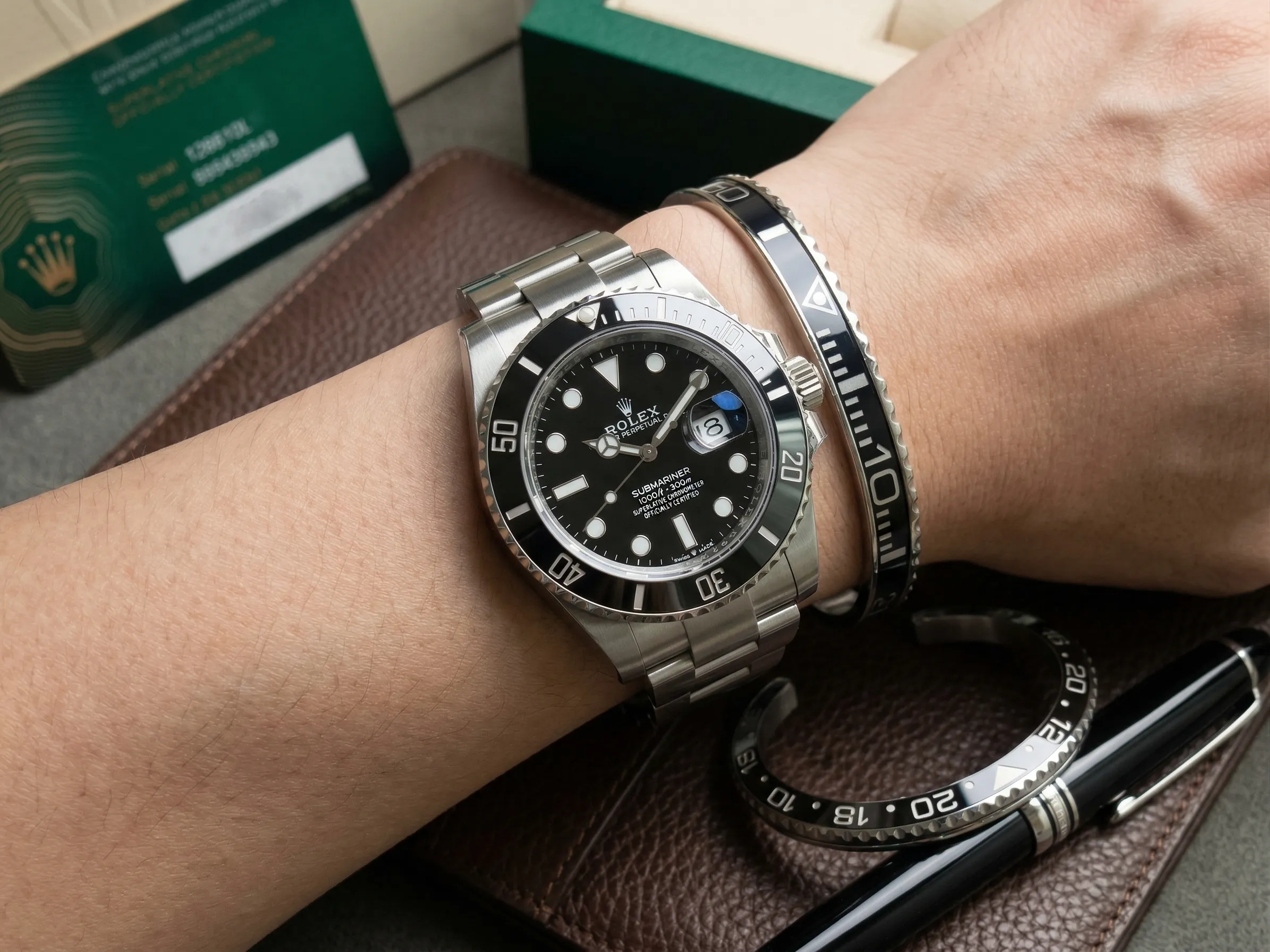 Close-up of a wrist wearing a sleek Black Submariner Titanium Steel Bracelet perfectly paired with a Rolex Submariner watch.