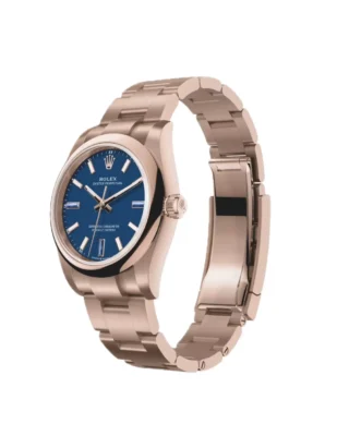 Rolex Oyster Perpetual Solid Gold 34mm Everose Gold (2026) — 18k Everose gold, blue dial with natural stone markers — angled view with open clasp and bracelet