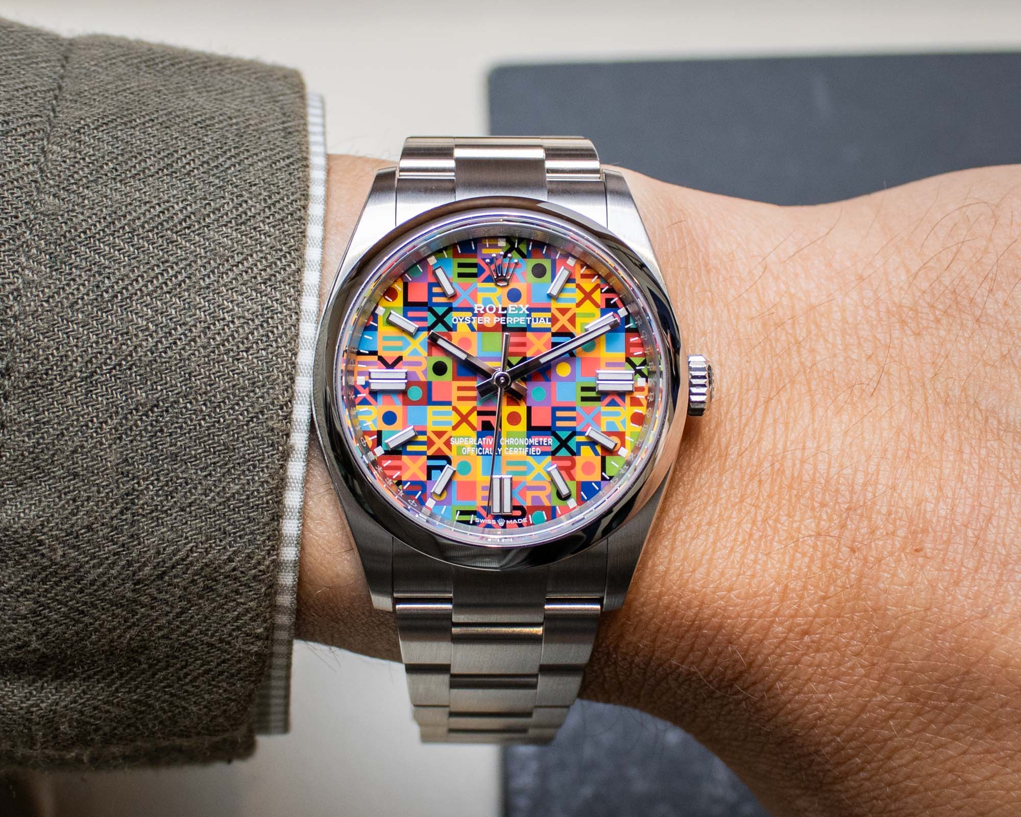 Rolex Oyster Perpetual 36 ref 126000 Jubilee Motif Dial 2026 front view showing multicolor ROLEX text pattern