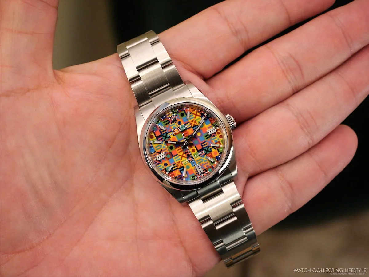 Rolex OP 36 126000 Jubilee Dial 2026 live photo showing multicolored repeating ROLEX text on dial
