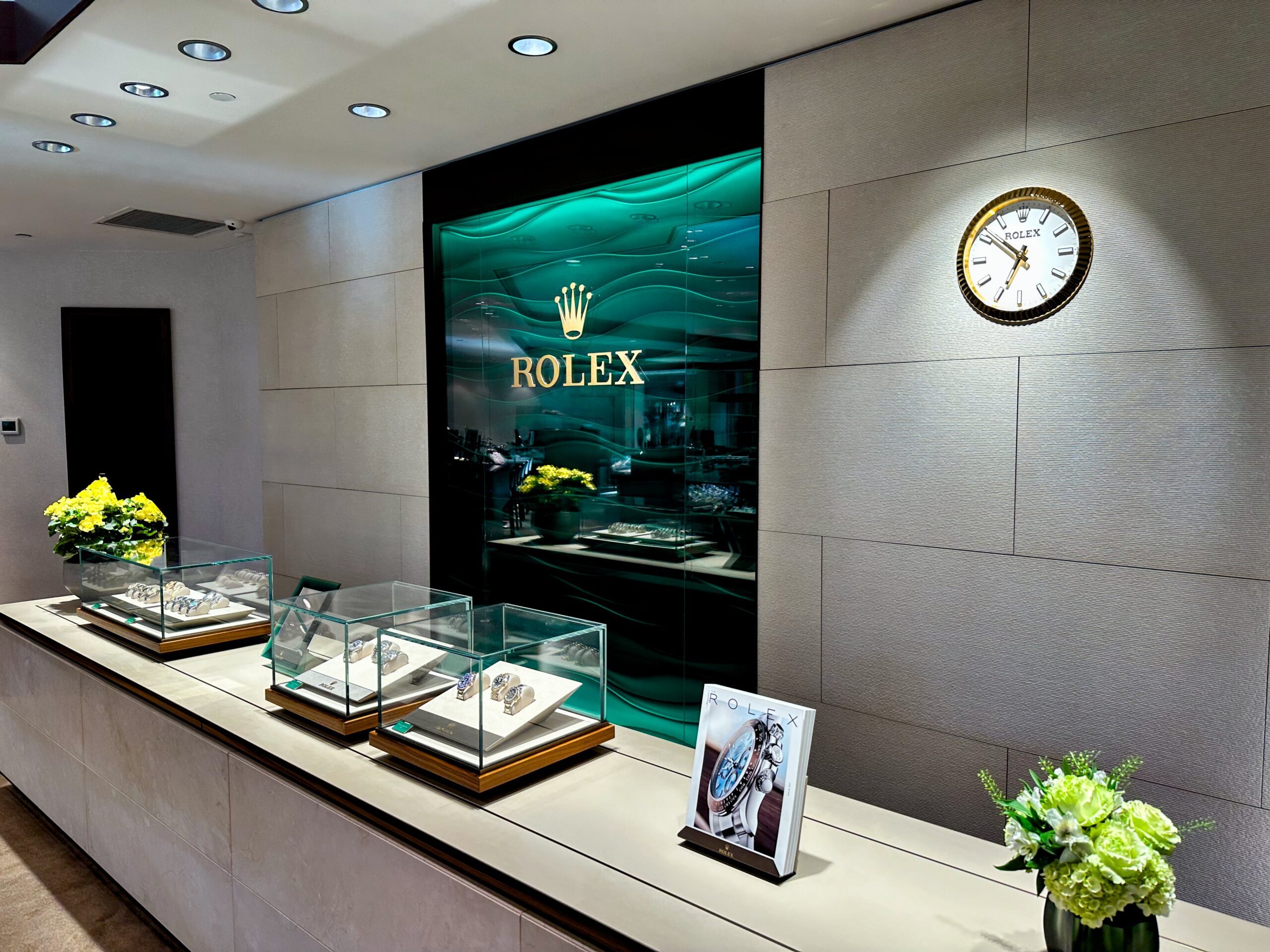 Rolex authorized dealer showcase display with luxury watch collection 2024